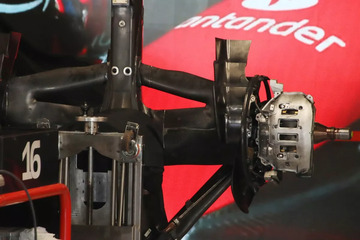 The Ferrari gearbox carrier and rear crash structure are stood on end, so we’re treated to a view of the rear suspension fairings and brake assembly from beneath.